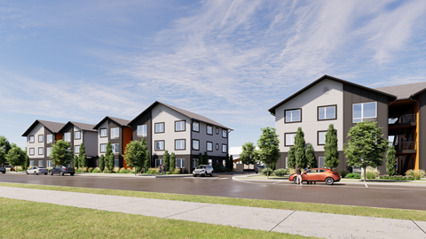 A row of modern townhouses with cars parked in front.
