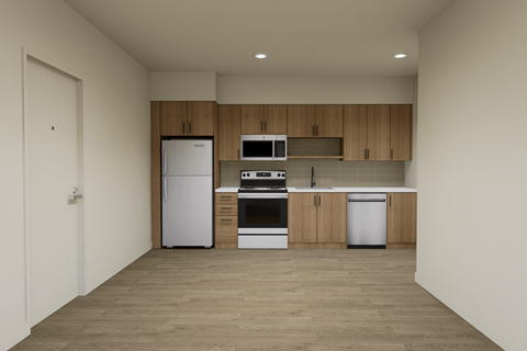 A kitchen with a refrigerator, oven, and microwave.