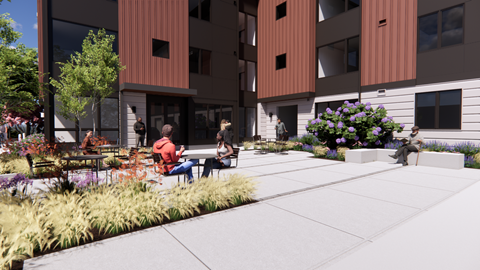 A modern building with a courtyard and people sitting and walking.