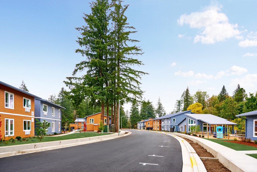 a row of houses on the side of a road