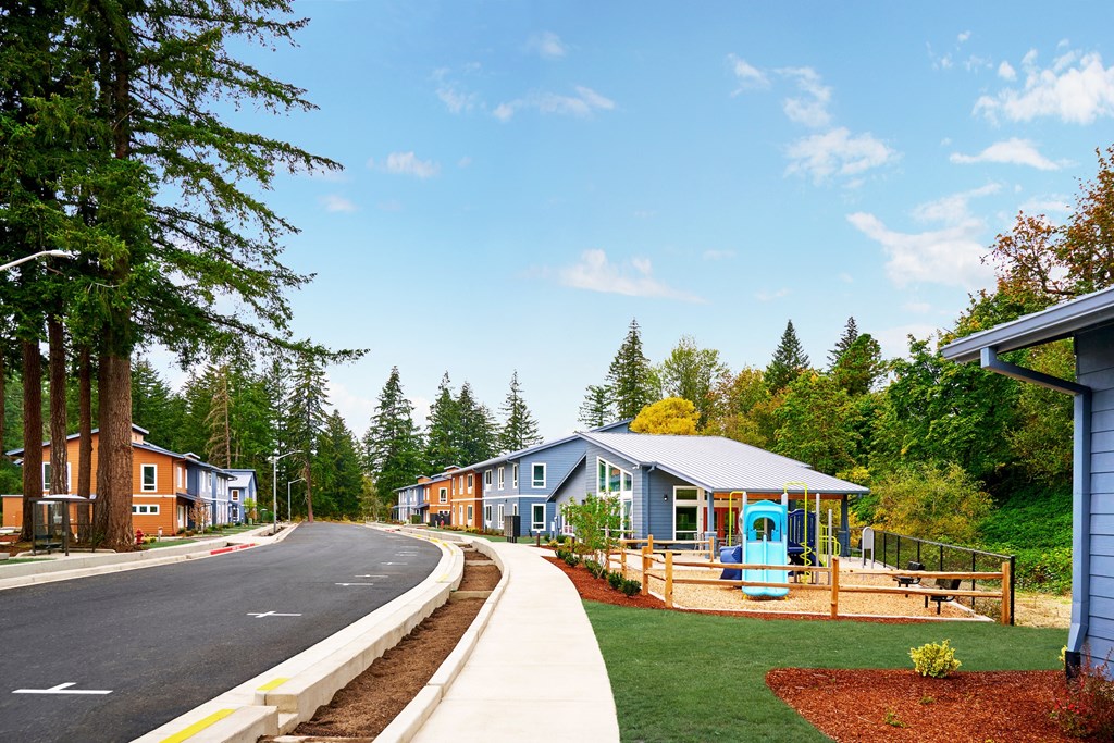 a row of houses on the side of a road