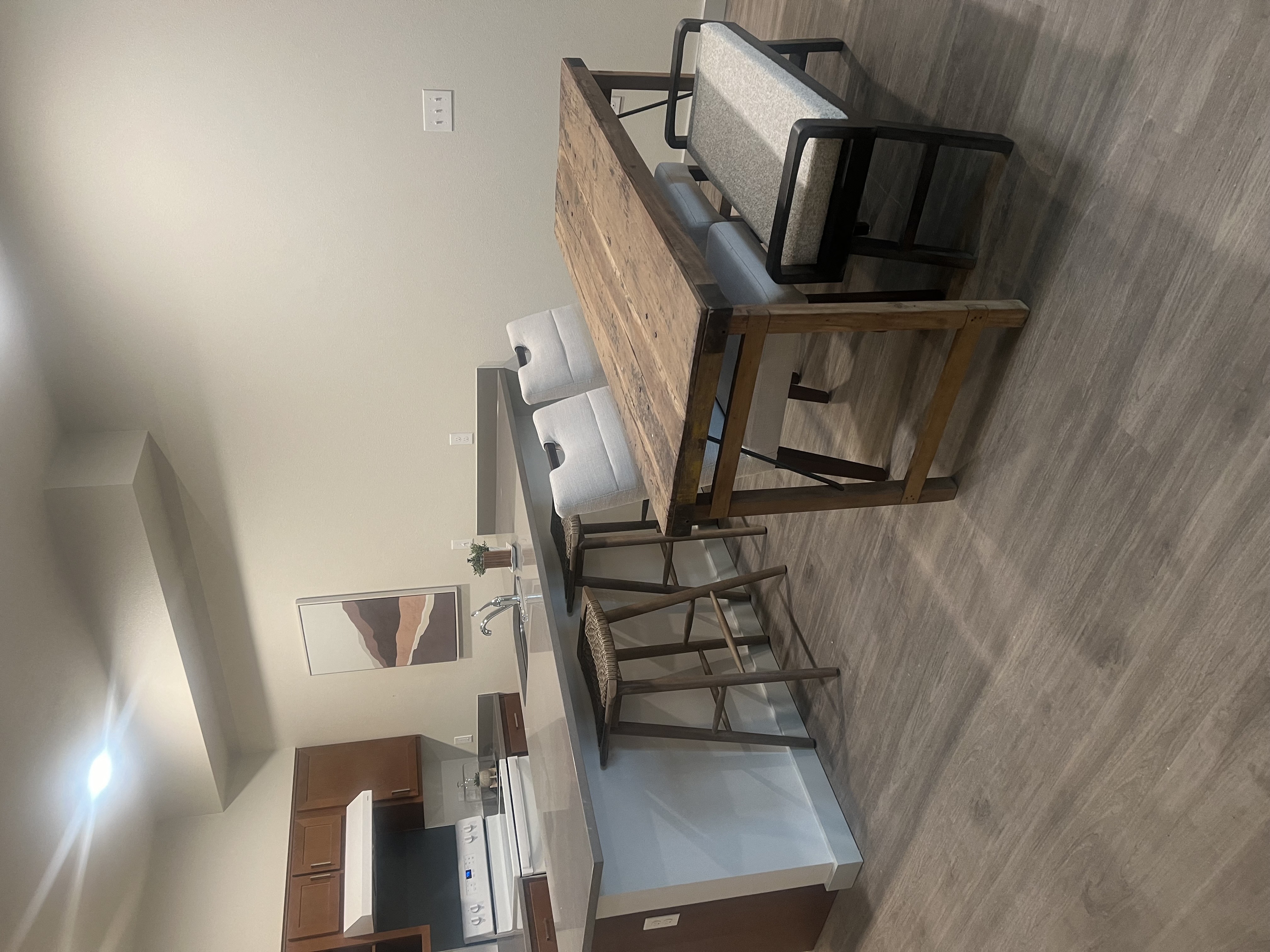 an overhead view of a living room with stairs and a tv on a wooden wall