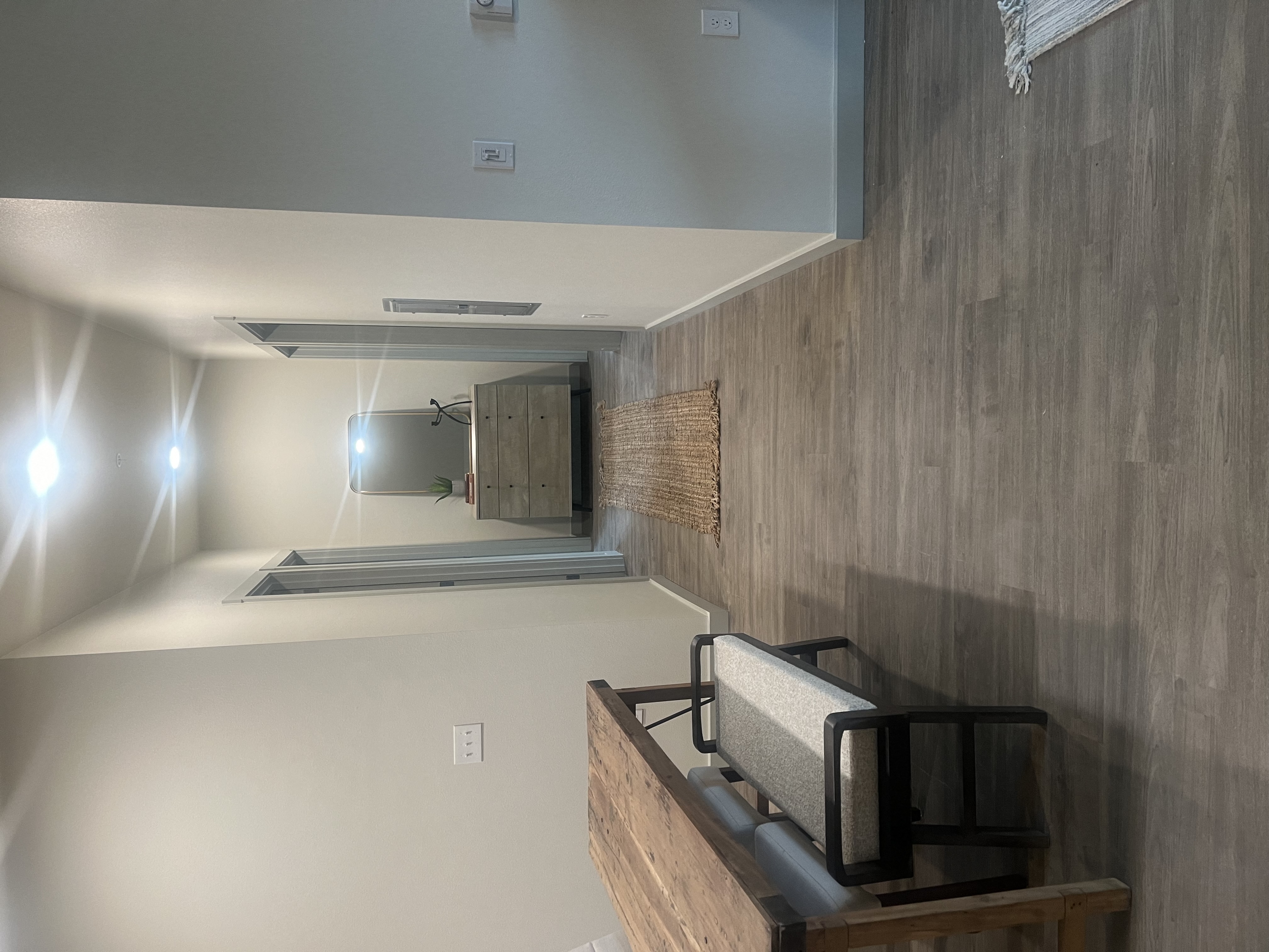 a kitchen with a counter top and a mirror on the wall