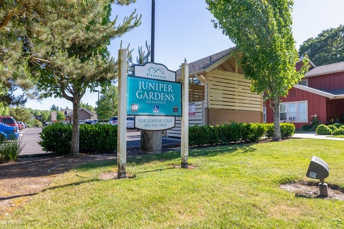 Juniper Gardens Property Sign