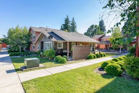 a house with a sidewalk in front of it