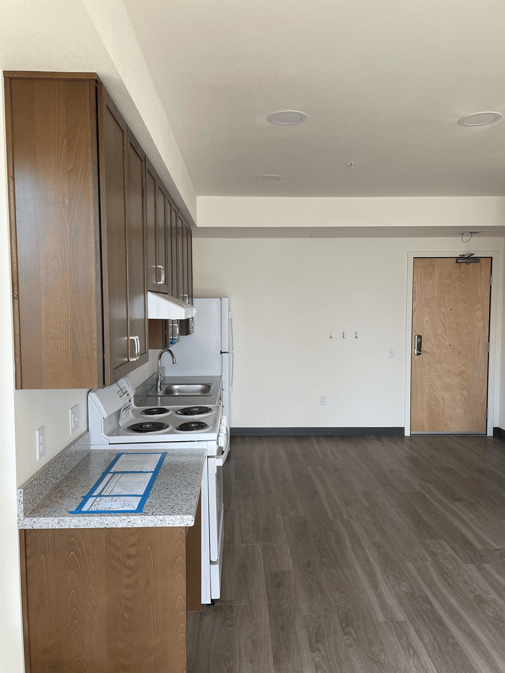 a kitchen and living room in a 555 waverly unit