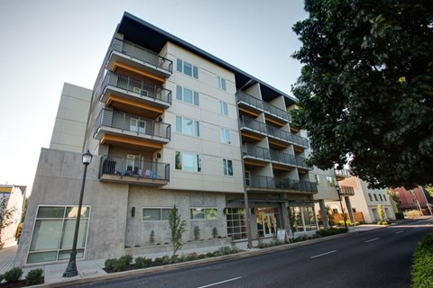 an image of an apartment building on a city street