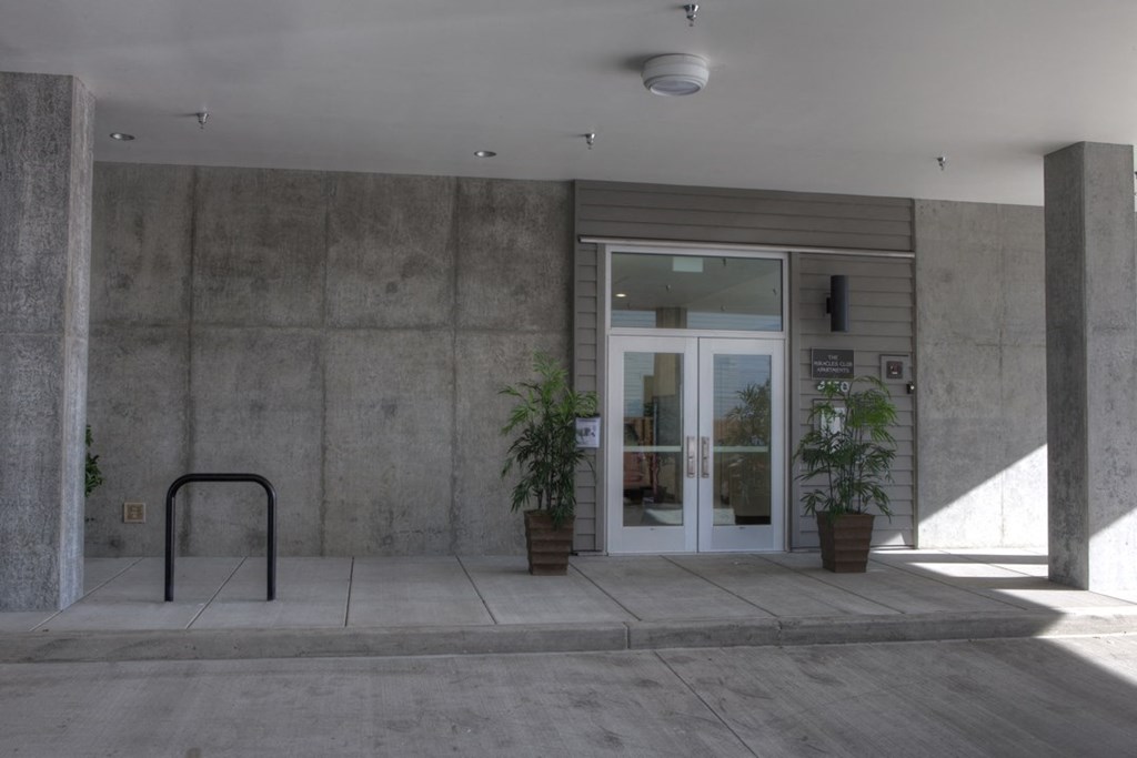the front entrance of a building with a glass door