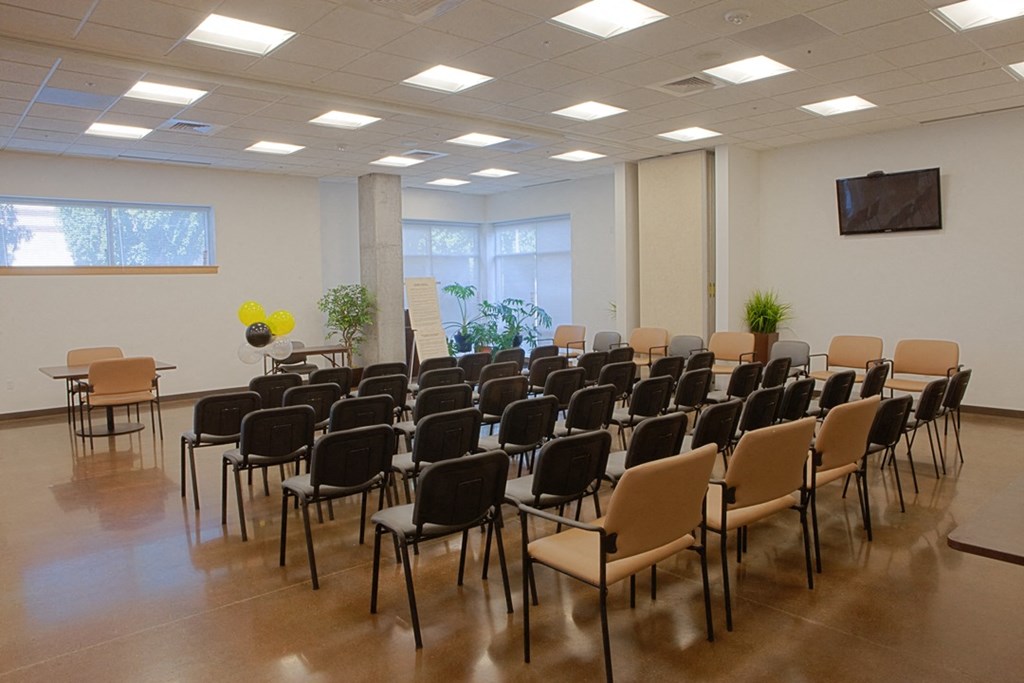 a conference room with chairs and tables in it