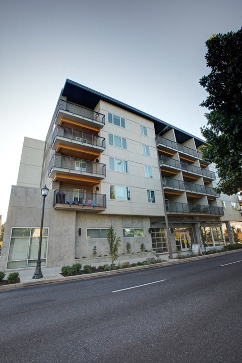an apartment building on the corner of a street