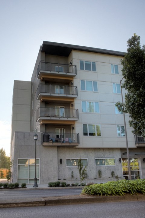 an apartment building on the corner of a street