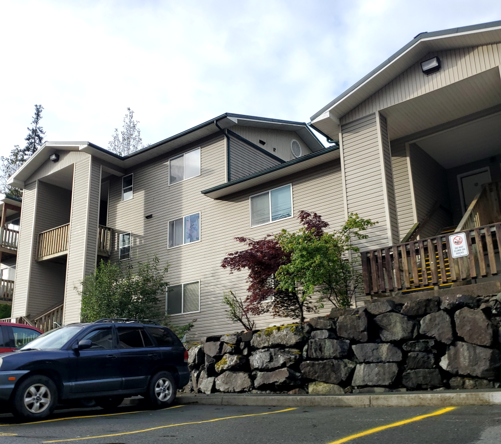a house with a car parked in front of it