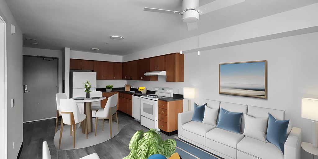 an open living room and kitchen with a white couch and a table