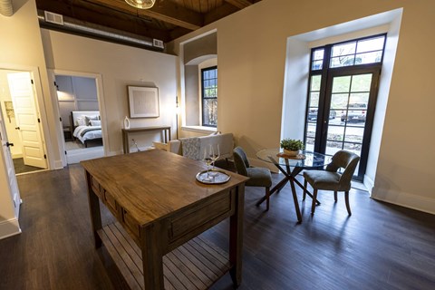 A dining room with a wooden table and chairs at The Dean at Creekview Apartments, Newark