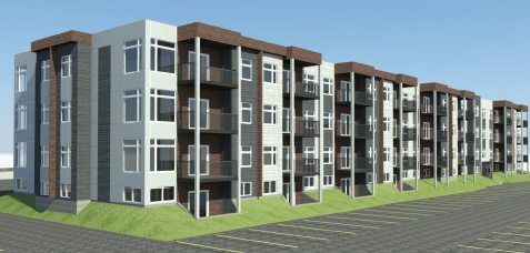 A row of modern apartment buildings with balconies and parking in front.