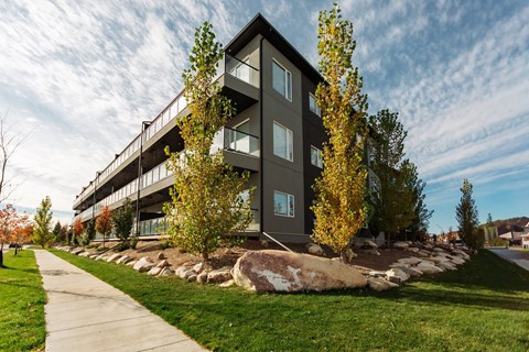 A modern building with a balcony on the second floor.