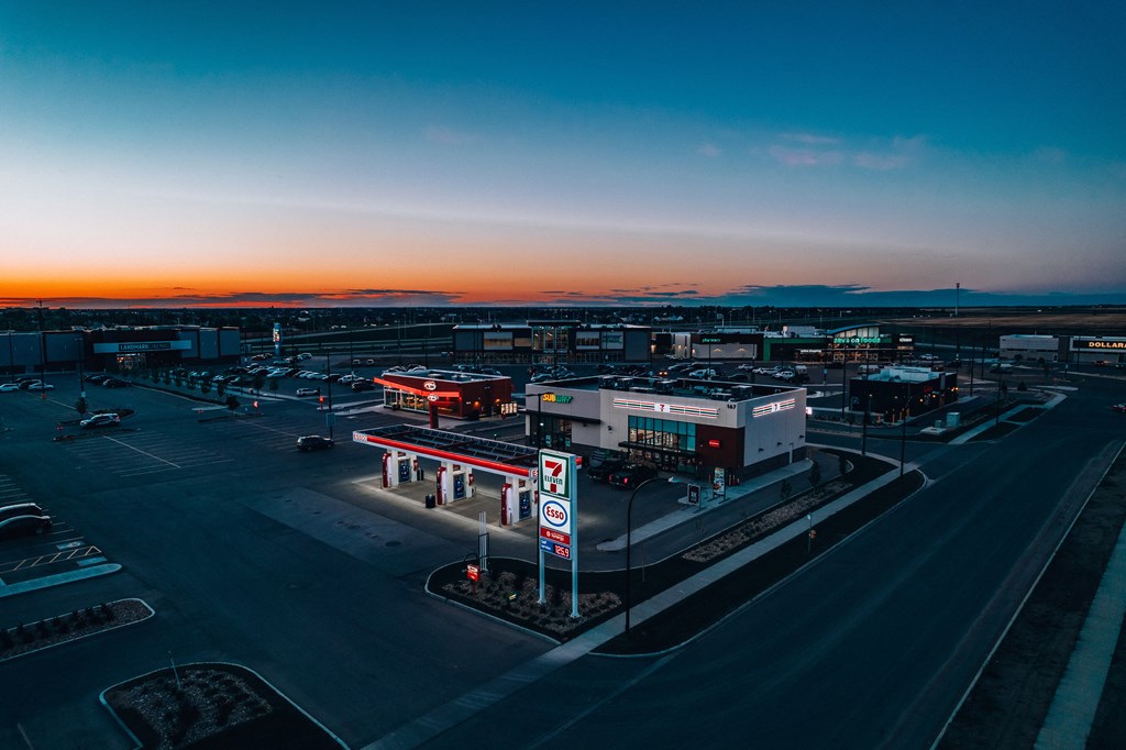 a gas station at dusk at an airport