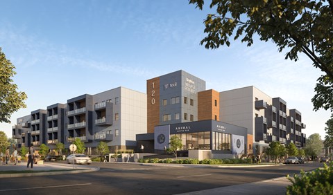 A modern building complex with a variety of businesses including a hotel and a restaurant.