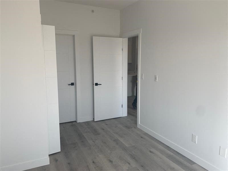 a empty room with white walls and doors