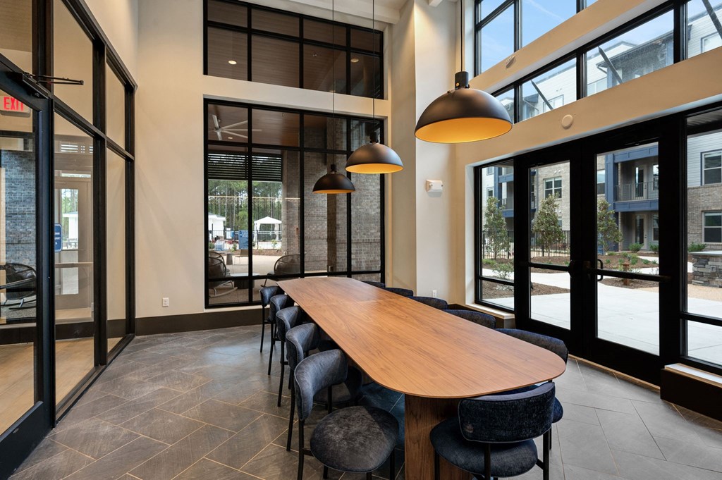 a large conference room with a wooden table and chairs at Preston Ridge, Cary, NC