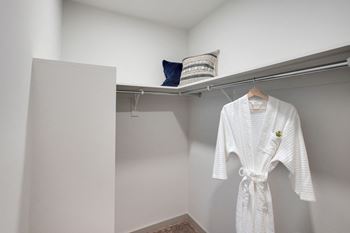 a white robe hanging on a hangar in a closet at Preston Ridge, North Carolina