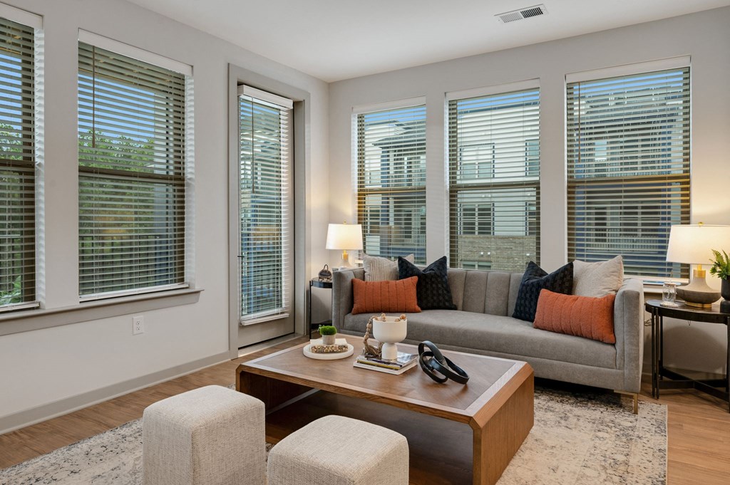 a living room with a couch and a coffee table at Preston Ridge, Cary