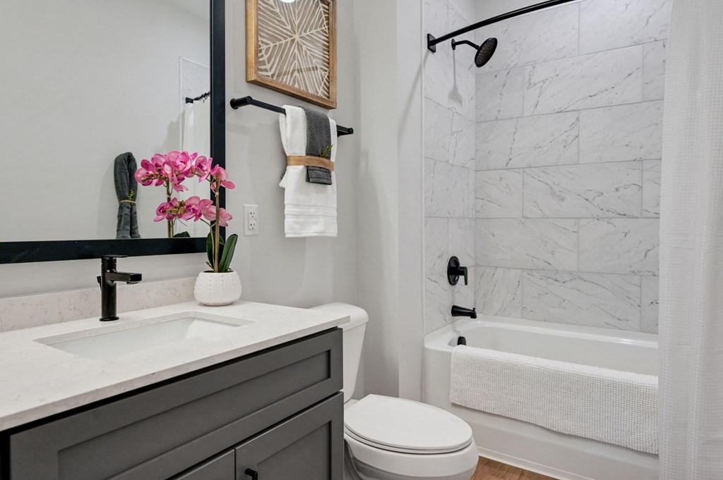 a white bathroom with a toilet and a sink at Preston Ridge, North Carolina, 27513