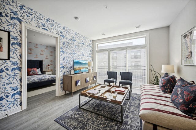 a living room with a couch and a table and a mirror at Park Kennedy, Washington, DC, 20003
