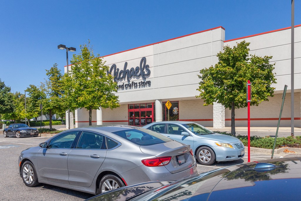 a car dealership with cars parked in front of it at Fairmont at South Lake, Bowie, Maryland