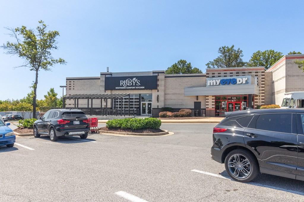 a parking lot with cars parked in front of a restaurant at Fairmont at South Lake, Bowie, MD, 20716