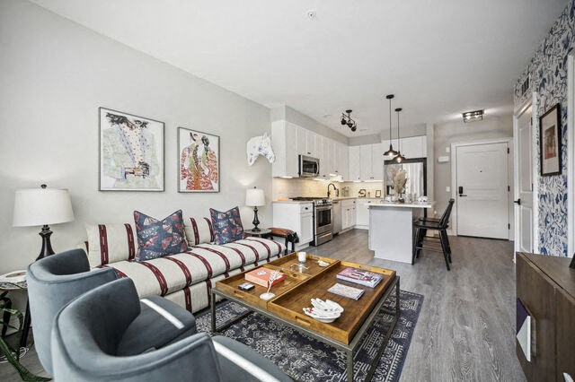 a living room with a couch and a table at Park Kennedy, Washington