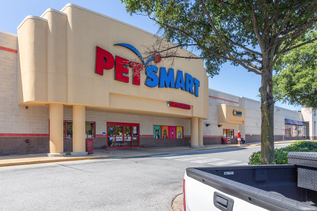 a pet smart store with a large tree in front of it at Fairmont at South Lake, Bowie, MD
