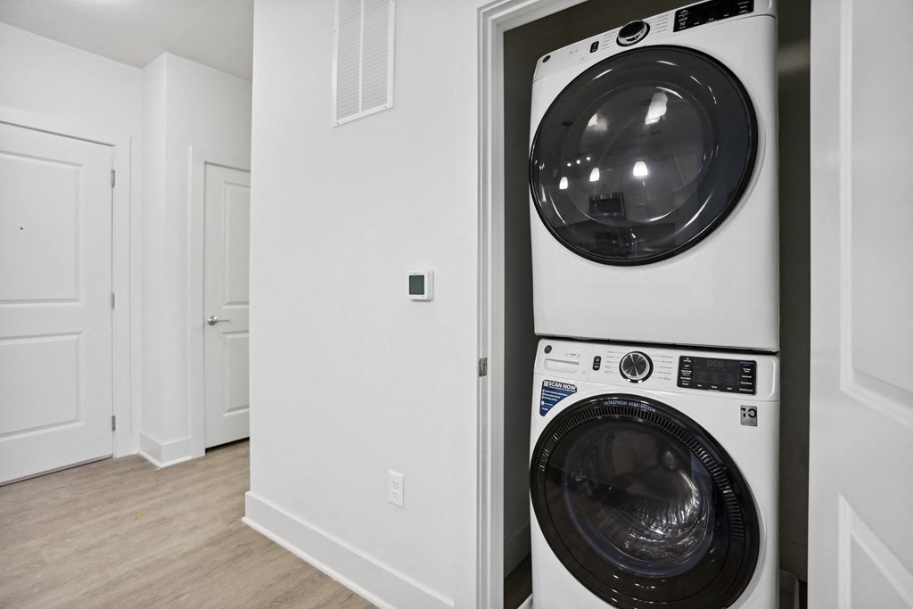 a washer and dryer in a laundry room at Fairmont at South Lake, Bowie Maryland