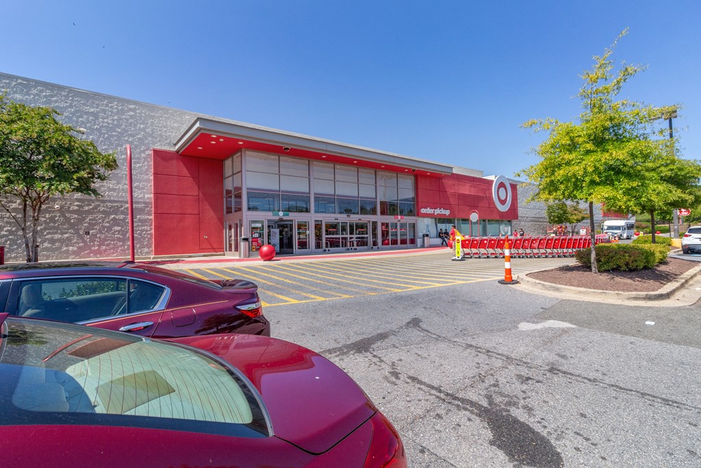 a red car parked in front of a building at Fairmont at South Lake, Bowie, MD