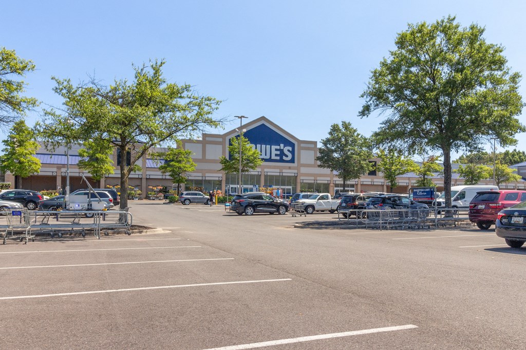 a shopping center with a parking lot in front of it at Fairmont at South Lake, Maryland