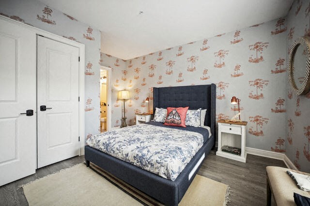 a bedroom with a bed and a white door at Park Kennedy, Washington, DC