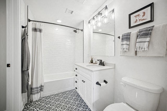 a white bathroom with a shower and a toilet at Park Kennedy, Washington, 20003