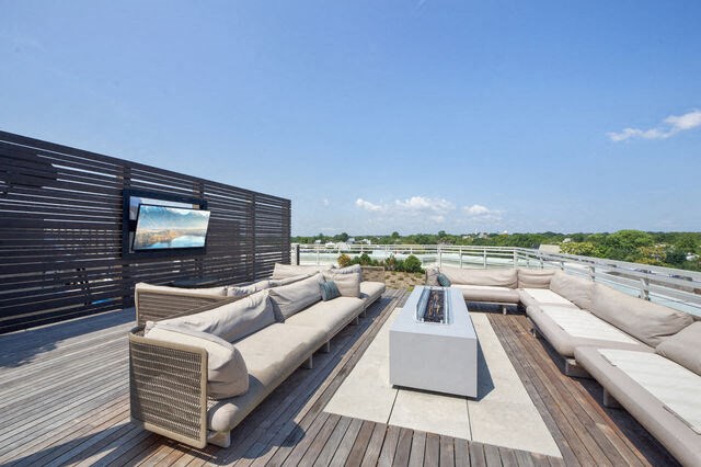 a patio with couches and a table on a roof at Park Kennedy, Washington, DC