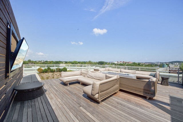 a terrace with couches and a table on a roof at Park Kennedy, Washington