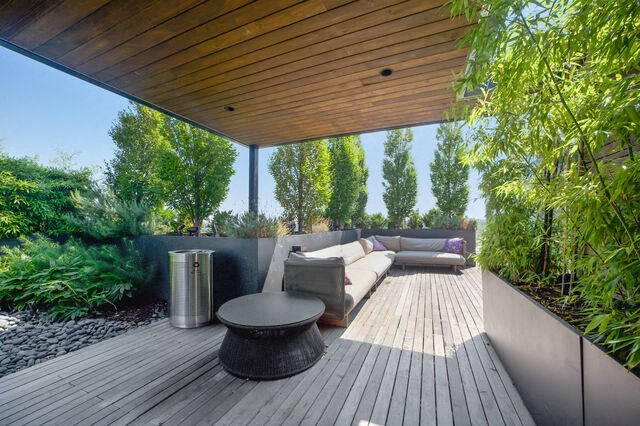 a patio with a couch and a table on a roof at Park Kennedy, Washington, 20003