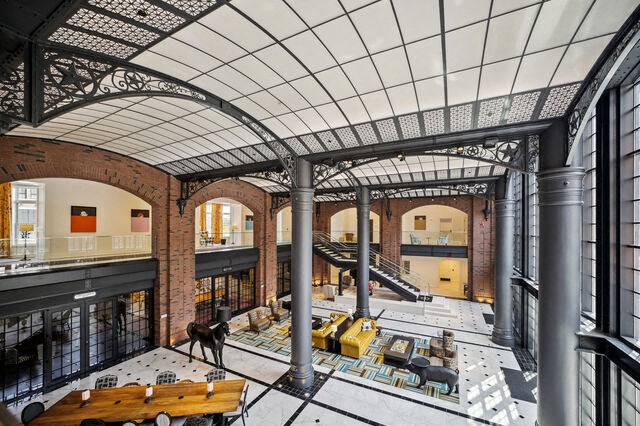 a view of the lobby of a large building with a ceiling and stairs at Park Kennedy, Washington
