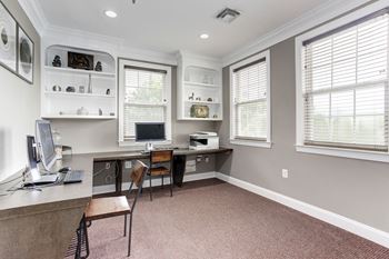 a home office with a desk and a computer at County Center Crossing Apartments in Woodbridge, VA