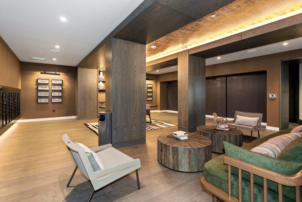 a large living room with wood floors and a fireplace at Vyne One Loudoun, Virginia
