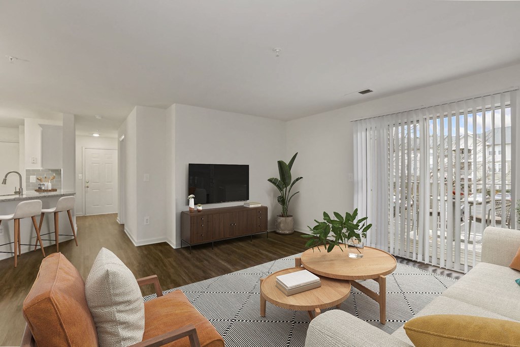 Living room with balcony at The Fields of Manassas