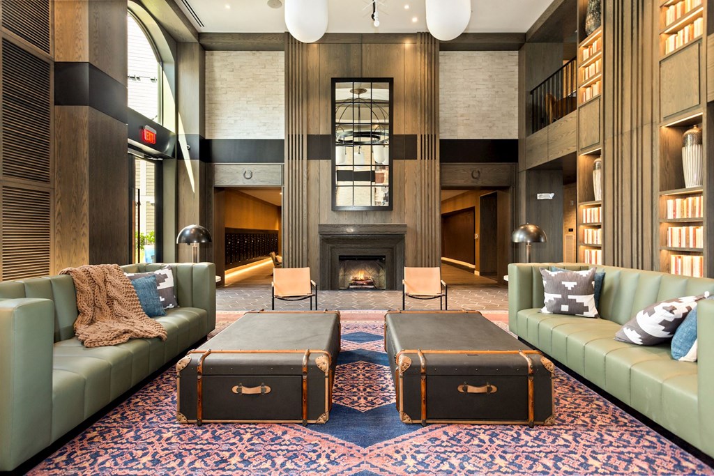 a lobby with couches and a fireplace at Vyne One Loudoun, Virginia