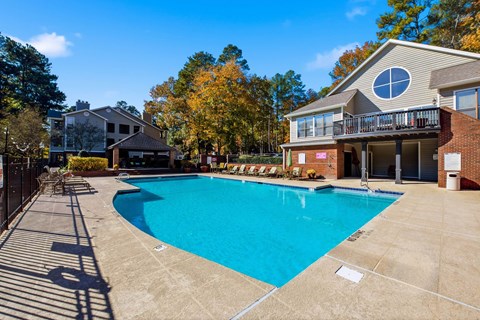 A large swimming pool in front of a house with a deck at Brampton Moors, Cary, NC, 27513