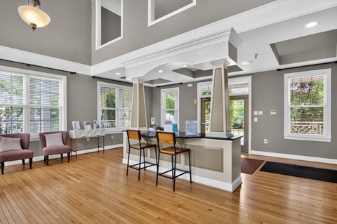 A reception area with a desk and chairs.