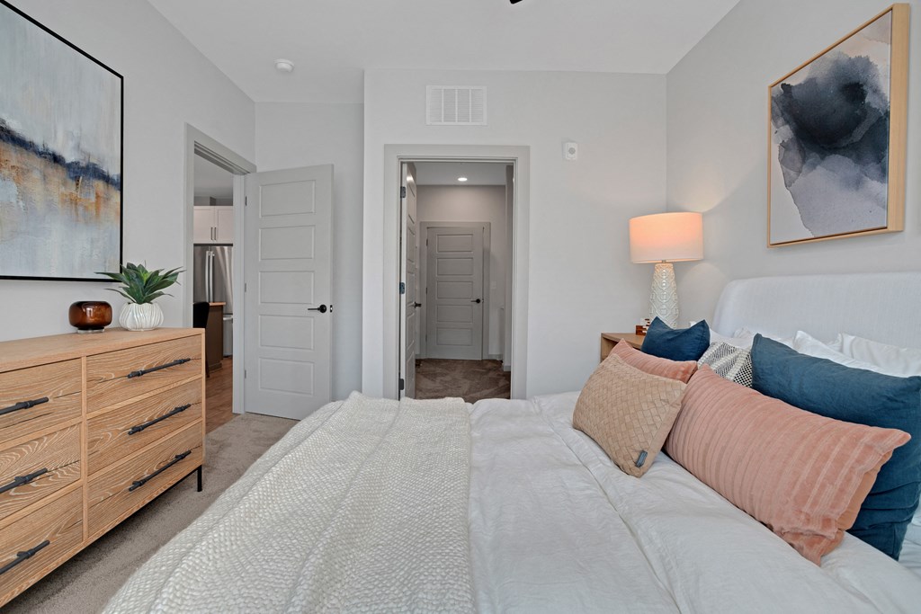 a bedroom with a large bed and a closet at Preston Ridge, Cary, NC