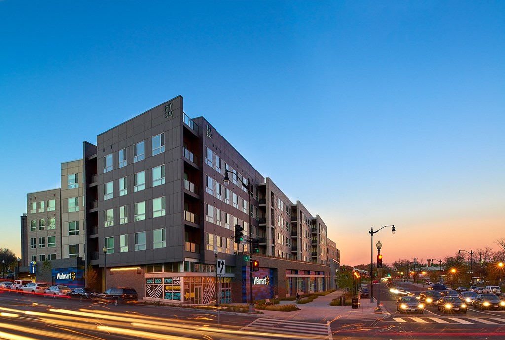 a large building on a city street at dusk at Fort Totten Square, Washington DC