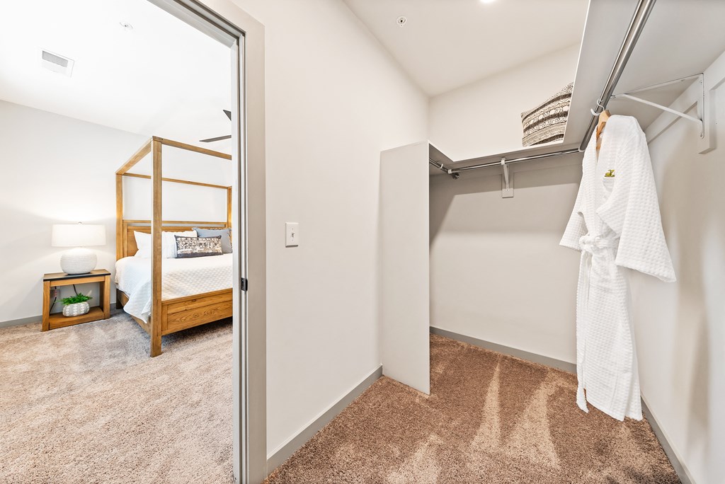 A white towel is hanging on a rack in a room